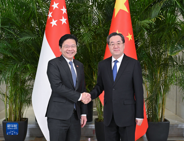 丁薛祥会见新加坡副总理兼财政部长黄循财并共同主持中新双边合作机制会议